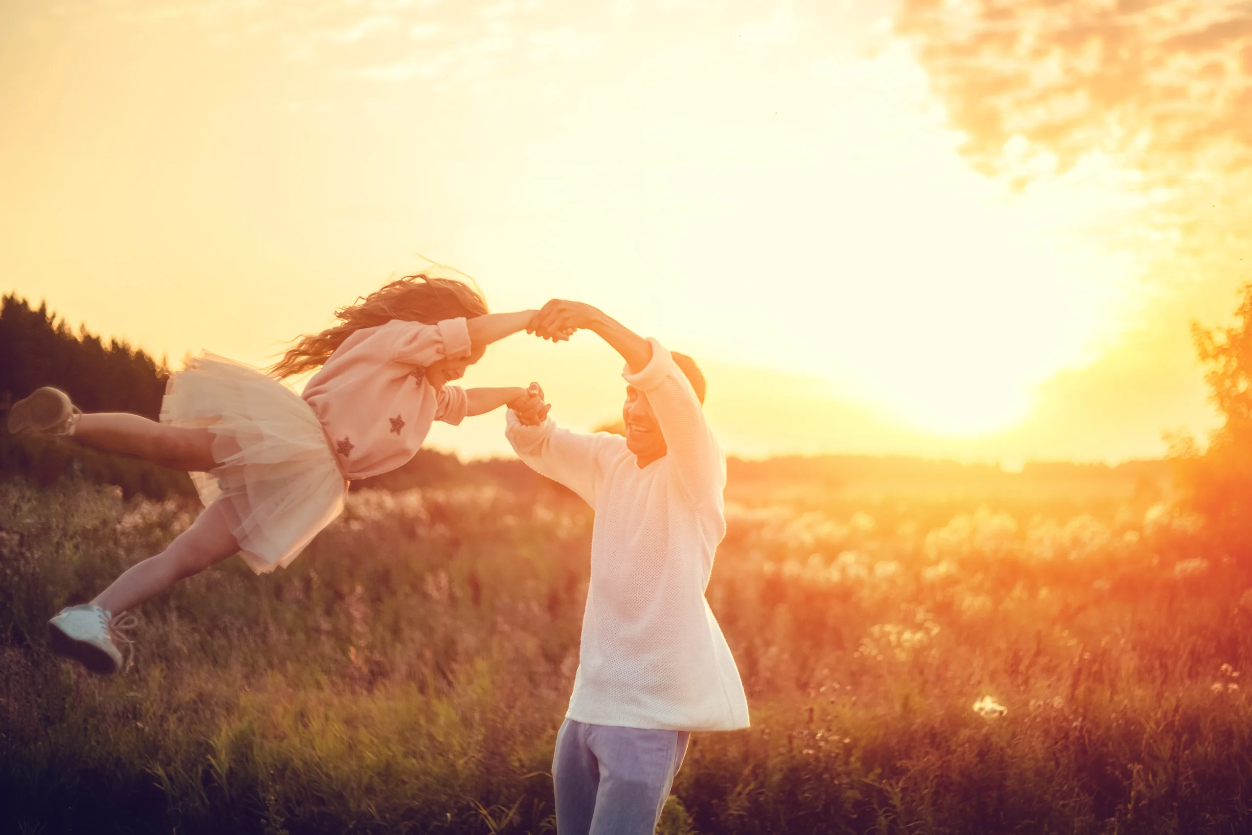 father and daughter playin in summer