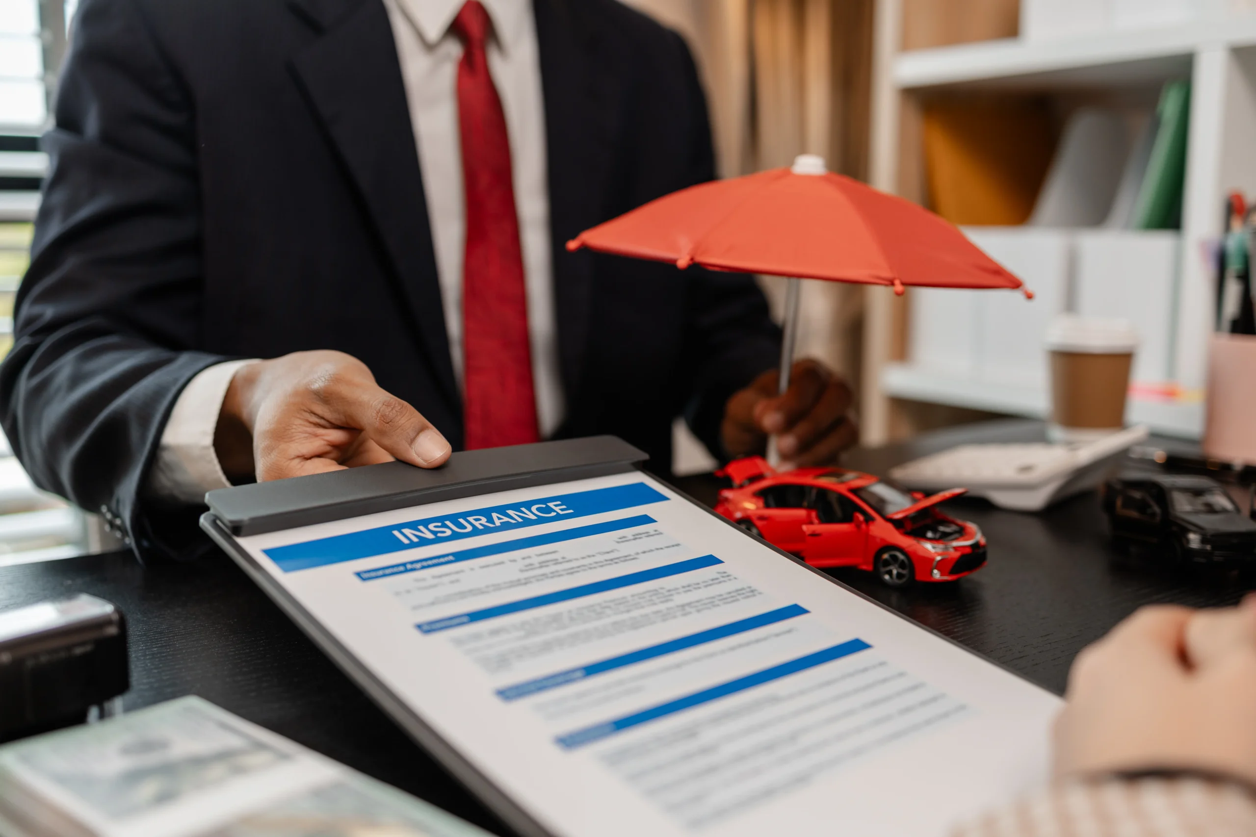 a lawyer explains the details of a car insurance policy and all the costs to a client, a lawyer explains to a client what will happen if she dose not have car insurance