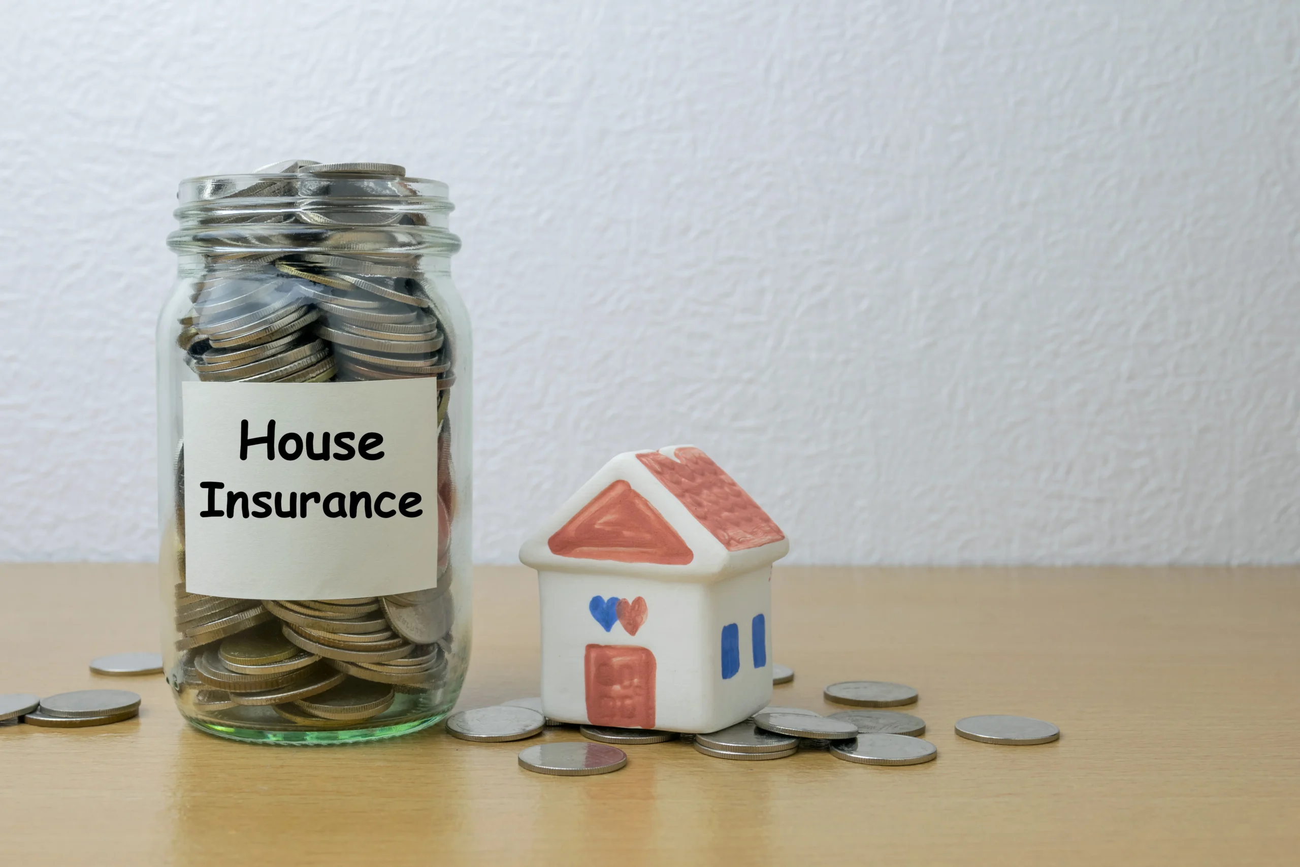 Money saving for house Insurance in the glass bottle